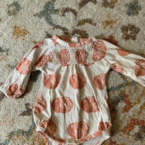 Kate Quinn organics pumpkin smocked bodysuit
